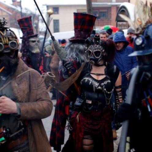 Revelers participate in a parade on the streets during a carnival to mark the annual Orthodox St. Vasilij Day in the village of Vevcani, south of the Macedonian capital of Skopje. REUTERS/Ognen Teofilovski